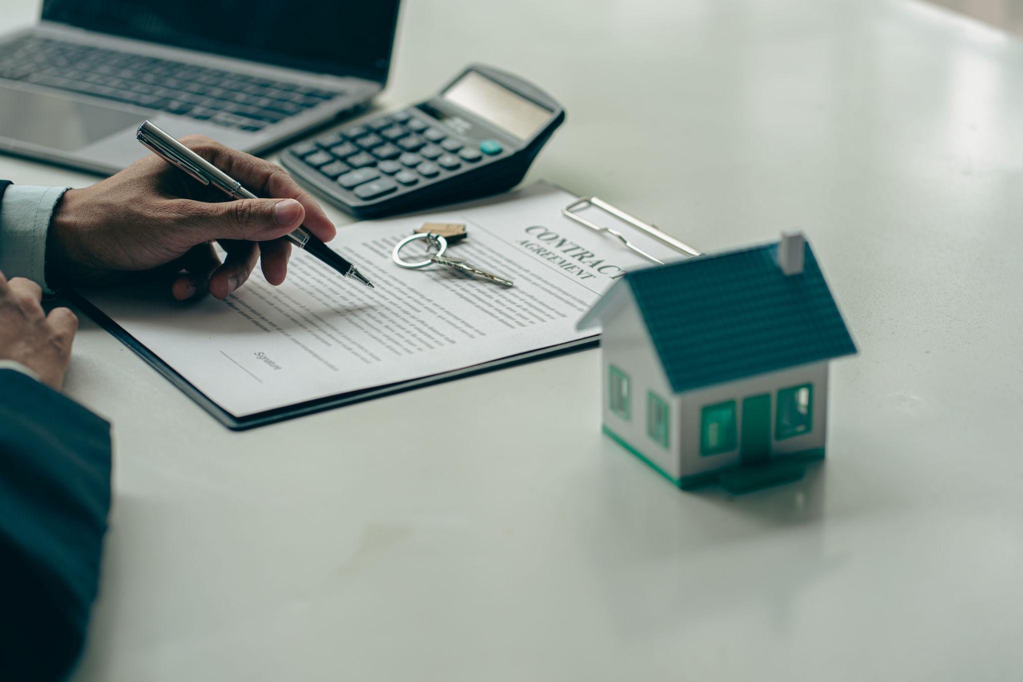 Home equity loan application with financial documents and a calculator