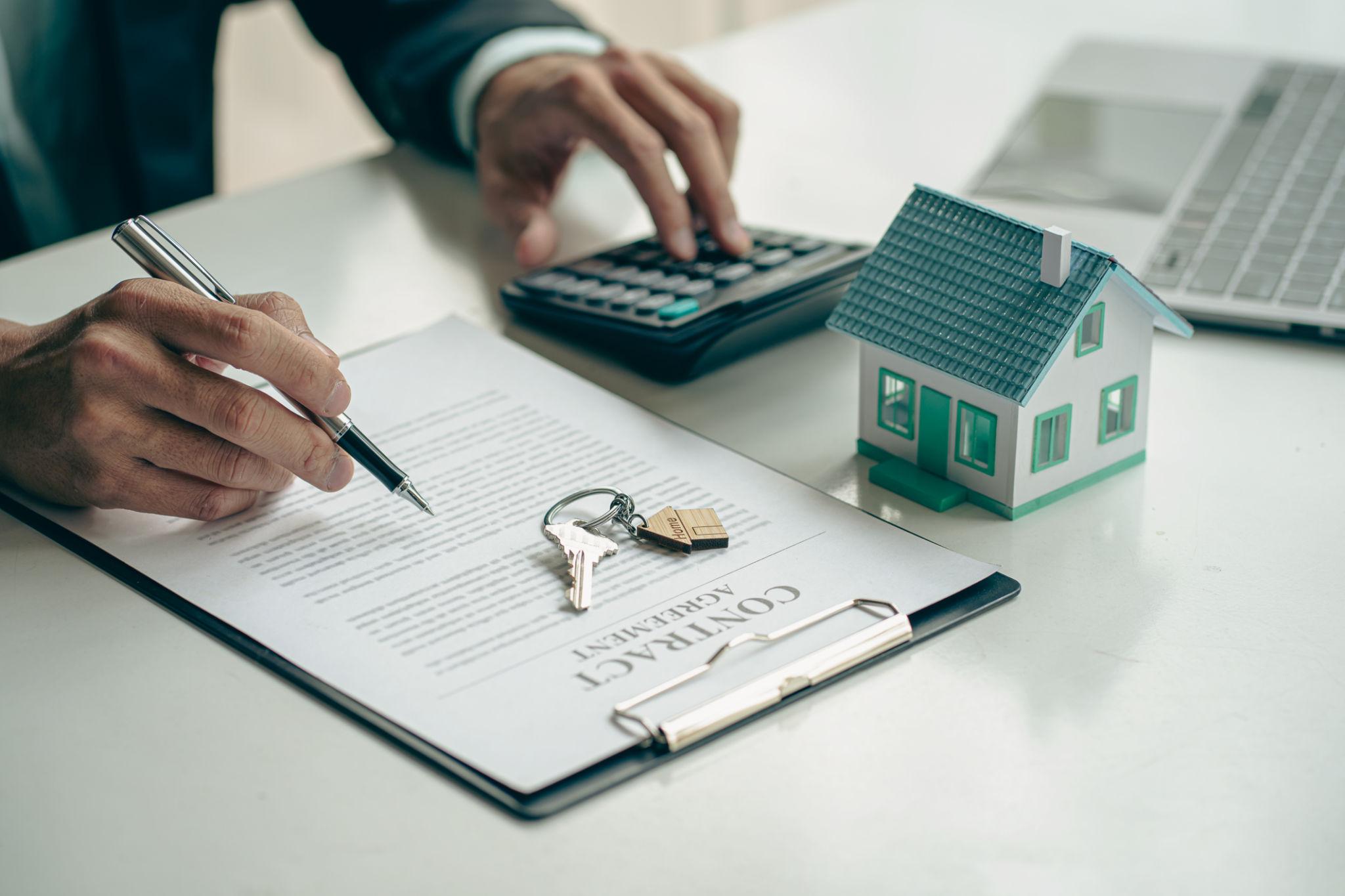 First-time homebuyer reviewing mortgage documents and planning home financing