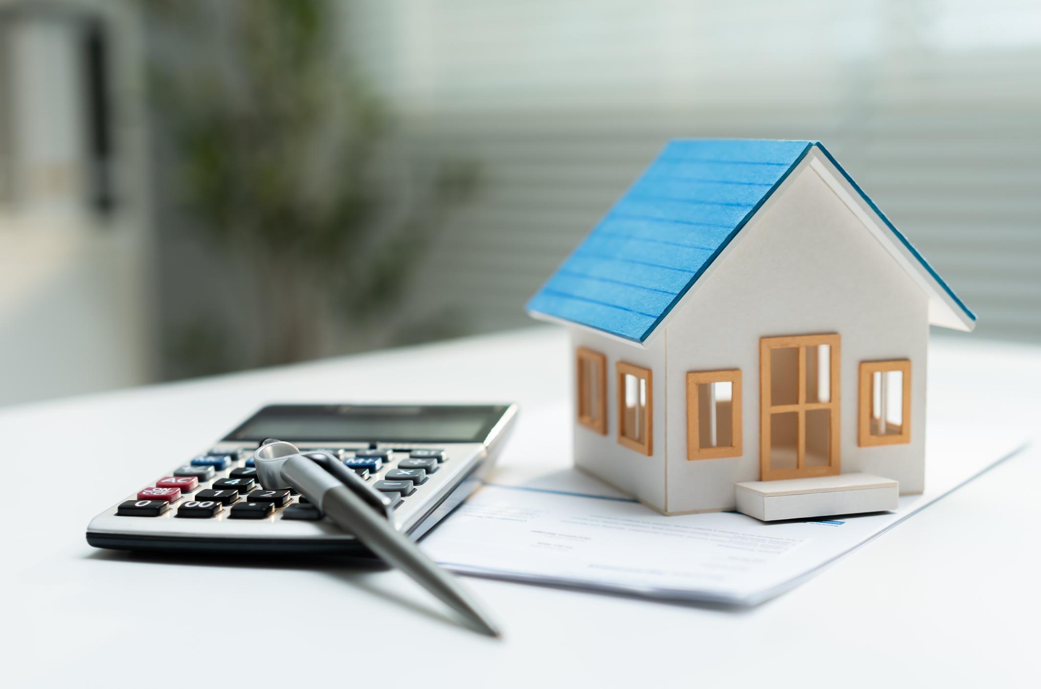 Mortgage paperwork and home model for comparing home loan options